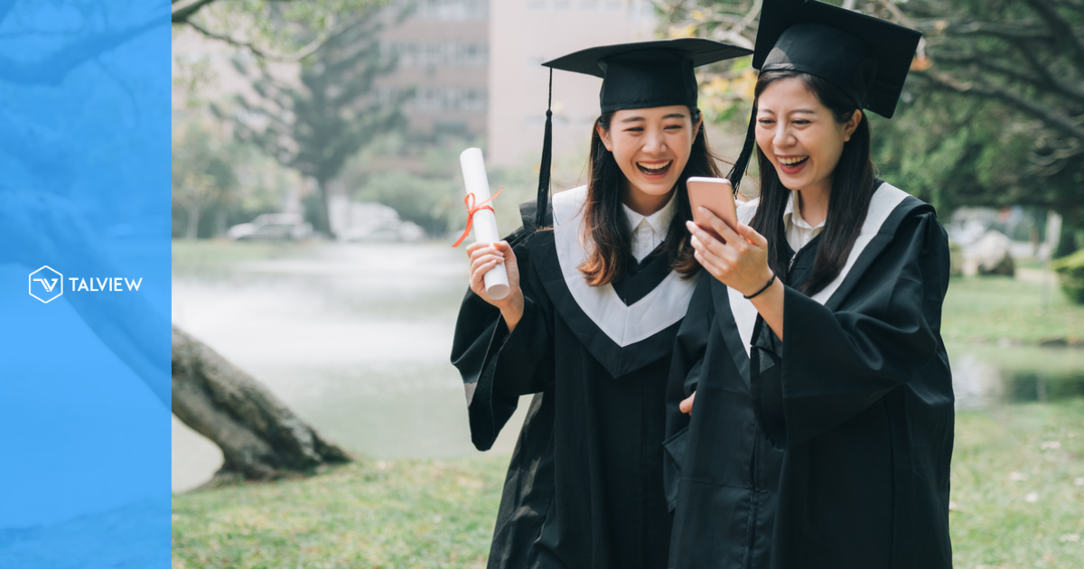 two happy college graduates